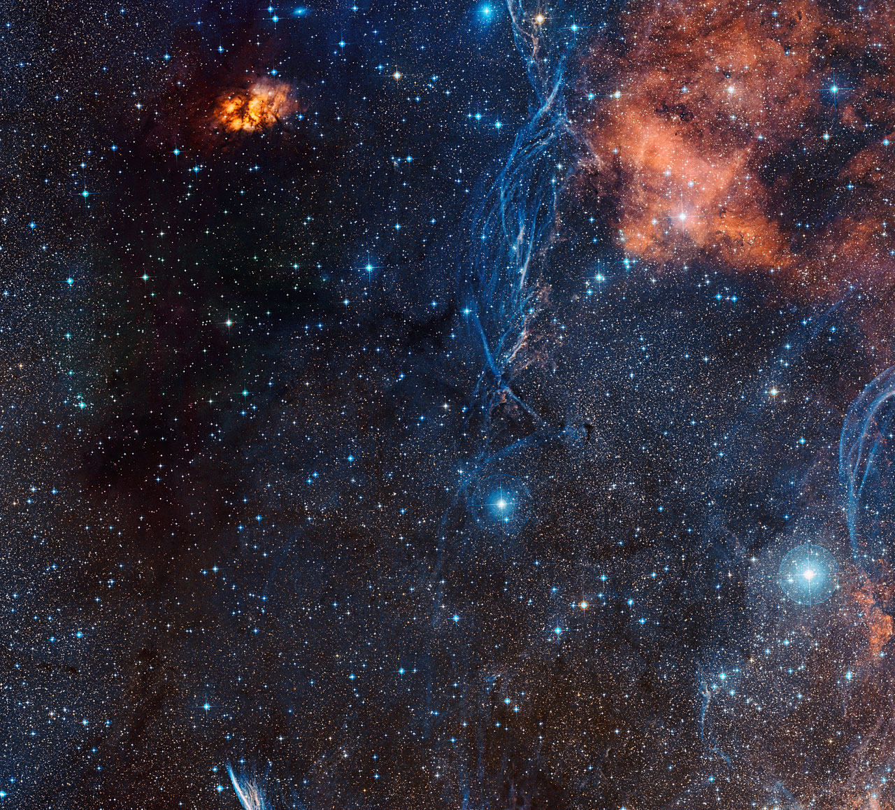 The rich celestial landscape around the aging double star IRAS 0